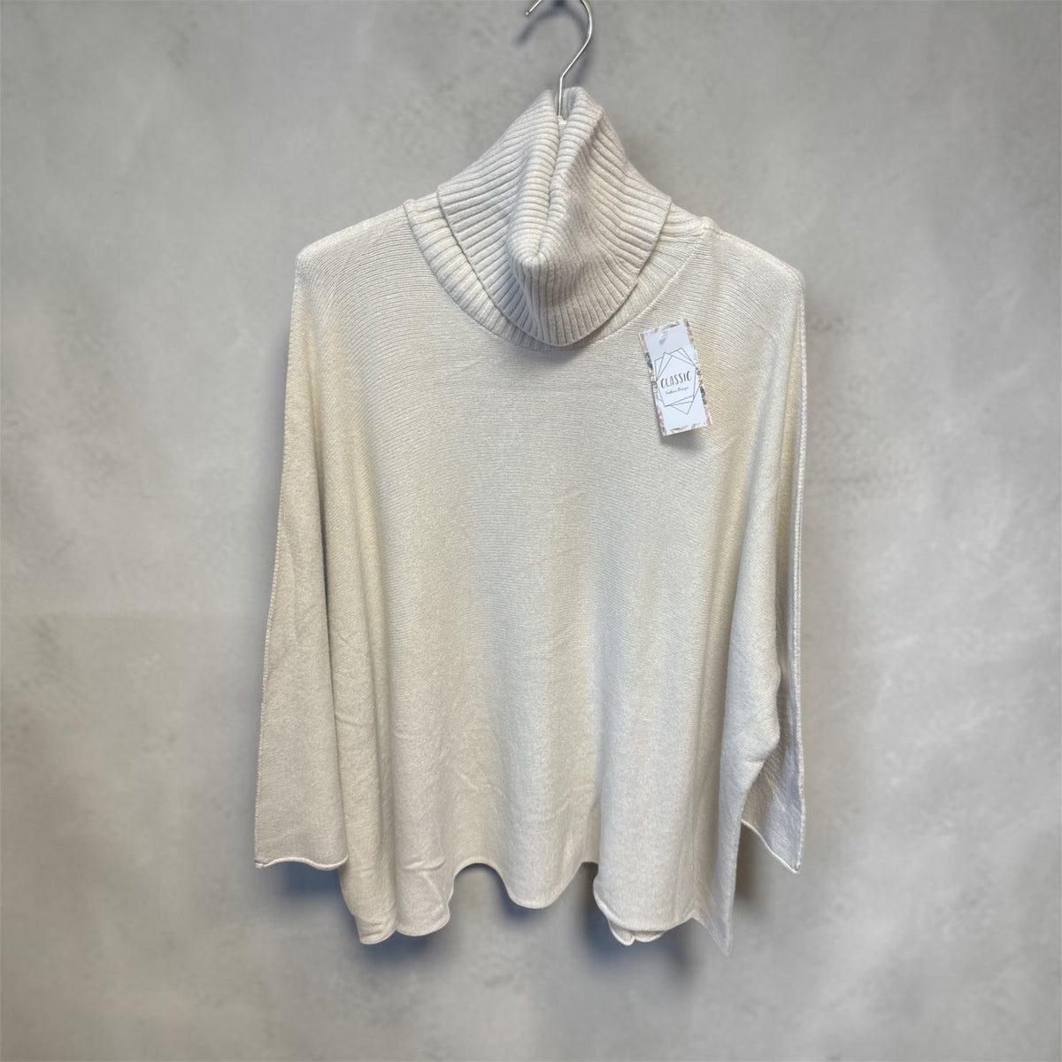 Pull beige, col roulé