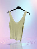 Top scintillant jaune pale